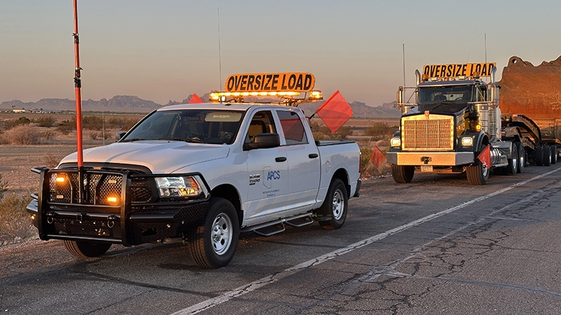 APCS pilot vehicle supporting an oversize load near El Mirage, Arizona